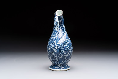 A Chinese blue and white double-spouted swirling-lobed cruet, Kangxi