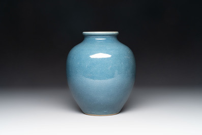 A Chinese black-glazed bottle vase, a blue-glazed jar and a powder-blue 'gu' vase on a wooden stand, Qianlong mark, 19/20th C.