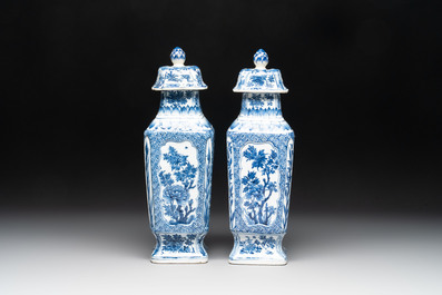 A pair of Chinese blue and white square vases and covers with floral design, Kangxi