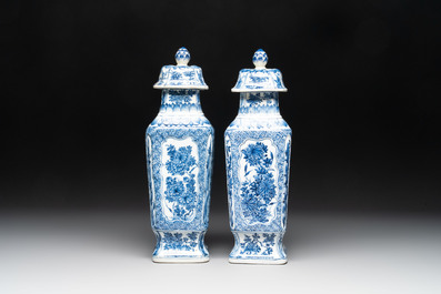 A pair of Chinese blue and white square vases and covers with floral design, Kangxi