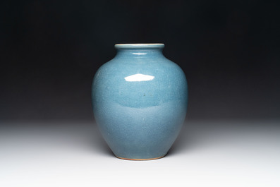 A Chinese black-glazed bottle vase, a blue-glazed jar and a powder-blue 'gu' vase on a wooden stand, Qianlong mark, 19/20th C.
