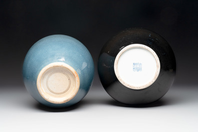 A Chinese black-glazed bottle vase, a blue-glazed jar and a powder-blue 'gu' vase on a wooden stand, Qianlong mark, 19/20th C.
