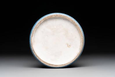 A Chinese black-glazed bottle vase, a blue-glazed jar and a powder-blue 'gu' vase on a wooden stand, Qianlong mark, 19/20th C.