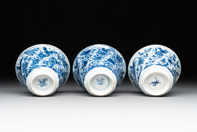 12 Chinese blue and white cups and 11 saucers with birds among flowering branches, Kangxi