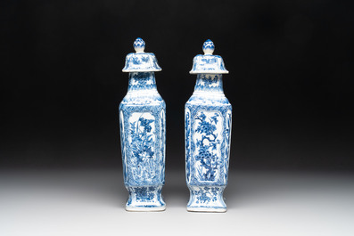A pair of Chinese blue and white square vases and covers with floral design, Kangxi