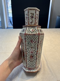 A pair of Chinese famille rose reticulated double-walled 'mandarin subject' vases, Qianlong