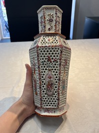 A pair of Chinese famille rose reticulated double-walled 'mandarin subject' vases, Qianlong