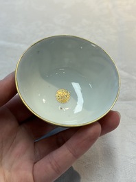 A Chinese Canton famille rose 'mandarin subject' cup and saucer, Qianlong