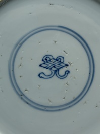 A Chinese gilt-decorated powder-blue plate and a famille verte plate with flowers, Kangxi/Qianlong