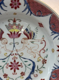 A pair of Chinese famille rose 'winged putti' plates, Yongzheng/Qianlong