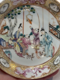 A Chinese Canton famille rose 'mandarin subject' cup and saucer, Qianlong