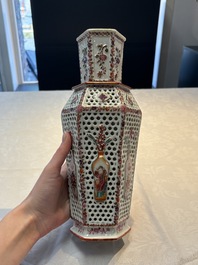 A pair of Chinese famille rose reticulated double-walled 'mandarin subject' vases, Qianlong