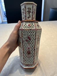 A pair of Chinese famille rose reticulated double-walled 'mandarin subject' vases, Qianlong