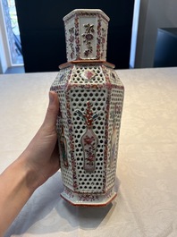 A pair of Chinese famille rose reticulated double-walled 'mandarin subject' vases, Qianlong