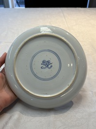 A Chinese gilt-decorated powder-blue plate and a famille verte plate with flowers, Kangxi/Qianlong