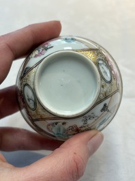 A Chinese Canton famille rose 'mandarin subject' cup and saucer, Qianlong