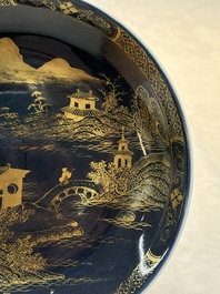 A Chinese gilt-decorated powder-blue plate and a famille verte plate with flowers, Kangxi/Qianlong