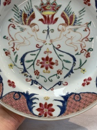 A pair of Chinese famille rose 'winged putti' plates, Yongzheng/Qianlong