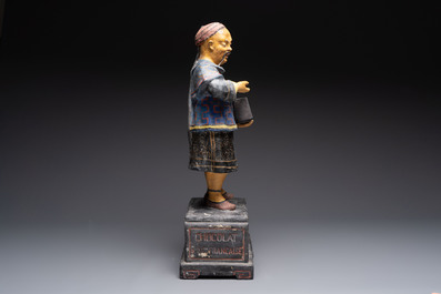 A French papier-m&acirc;ch&eacute; figure of a mandarin, inscribed 'Compagnie Fran&ccedil;aise Des Chocolats et Des Th&eacute;s', 20th C.