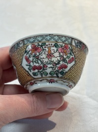 A fine Chinese gilt-decorated famille rose 'flower basket' cup and saucer, Yongzheng
