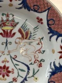 A pair of Chinese famille rose 'winged putti' plates, Yongzheng/Qianlong
