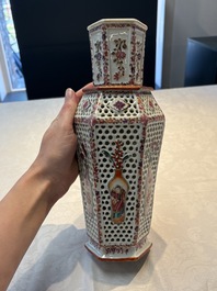 A pair of Chinese famille rose reticulated double-walled 'mandarin subject' vases, Qianlong