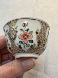A fine Chinese gilt-decorated famille rose cup and saucer with floral design, Yongzheng