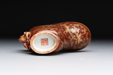 A Chinese gilt-decorated brown-glazed libation cup with a chilong-form handle, Qianlong mark and of the period