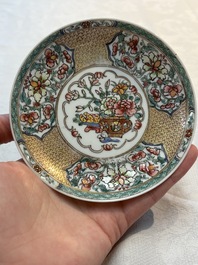 A fine Chinese gilt-decorated famille rose 'flower basket' cup and saucer, Yongzheng
