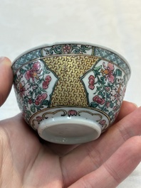 A fine Chinese gilt-decorated famille rose 'flower basket' cup and saucer, Yongzheng