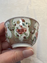 A fine Chinese gilt-decorated famille rose cup and saucer with floral design, Yongzheng