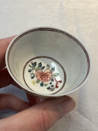 A fine Chinese gilt-decorated famille rose cup and saucer with floral design, Yongzheng