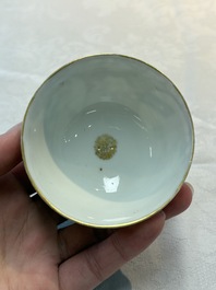 A Chinese Canton famille rose 'mandarin subject' cup and saucer, Qianlong