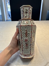 A pair of Chinese famille rose reticulated double-walled 'mandarin subject' vases, Qianlong