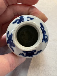 A pair of Chinese blue and white 'Long Eliza' miniature vases and wooden covers, Kangxi