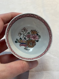 A fine Chinese gilt-decorated famille rose 'flower basket' cup and saucer, Yongzheng
