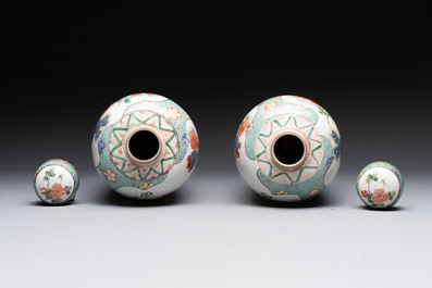 A pair of famille verte-style ovoid jars and covers, Samson, Paris, 19th C.