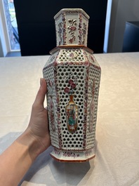 A pair of Chinese famille rose reticulated double-walled 'mandarin subject' vases, Qianlong