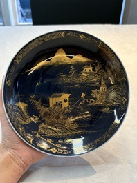A Chinese gilt-decorated powder-blue plate and a famille verte plate with flowers, Kangxi/Qianlong