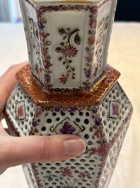 A pair of Chinese famille rose reticulated double-walled 'mandarin subject' vases, Qianlong