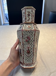 A pair of Chinese famille rose reticulated double-walled 'mandarin subject' vases, Qianlong
