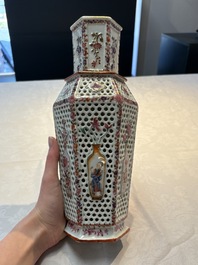 A pair of Chinese famille rose reticulated double-walled 'mandarin subject' vases, Qianlong