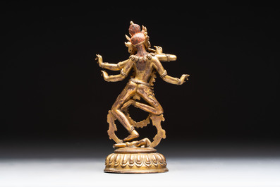 A Nepalese or Tibetan turquoise-inlaid gilt-bronze sculpture of Kurukulla or Red Tara, 15th C. or later