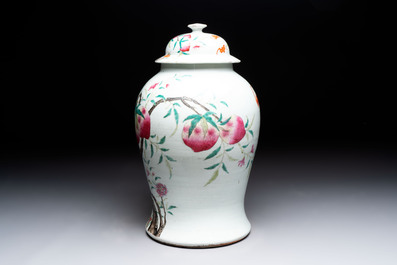 A Chinese famille rose 'nine peaches' vase and cover, 19th C.