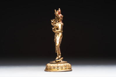 A Nepalese or Tibetan turquoise-inlaid gilt-bronze sculpture of Kurukulla or Red Tara, 15th C. or later