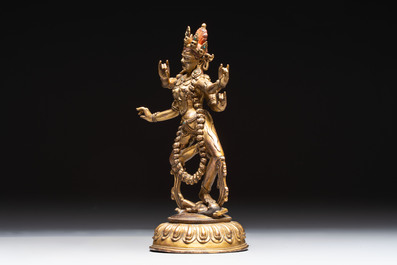 A Nepalese or Tibetan turquoise-inlaid gilt-bronze sculpture of Kurukulla or Red Tara, 15th C. or later