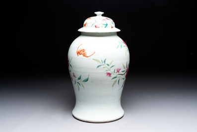 A Chinese famille rose 'nine peaches' vase and cover, 19th C.