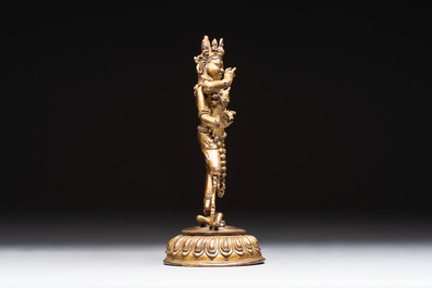A Nepalese or Tibetan turquoise-inlaid gilt-bronze sculpture of Kurukulla or Red Tara, 15th C. or later