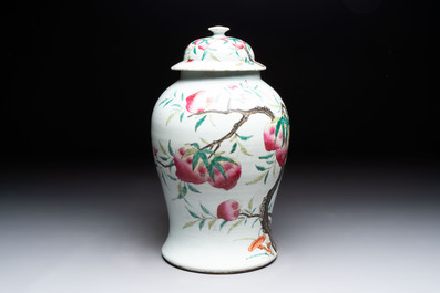 A Chinese famille rose 'nine peaches' vase and cover, 19th C.