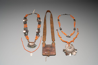 A varied group of four Islamic necklaces and a Quran holder, 19th C.